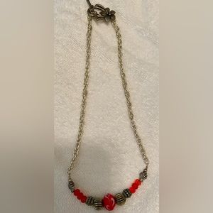 Necklace silver w/ red swirl & silver beads in center & beautiful clasp